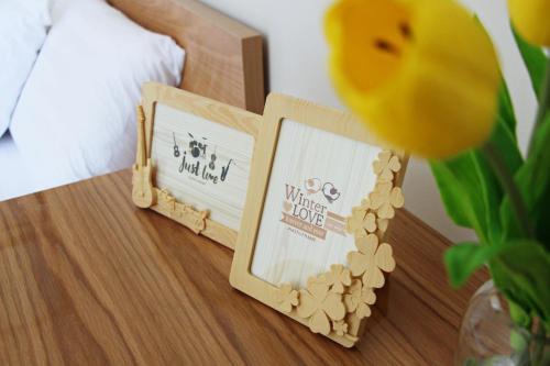 a wooden box on a table with a sign on it at 91 Homestay, Cafe, Bonsai in Vung Tau