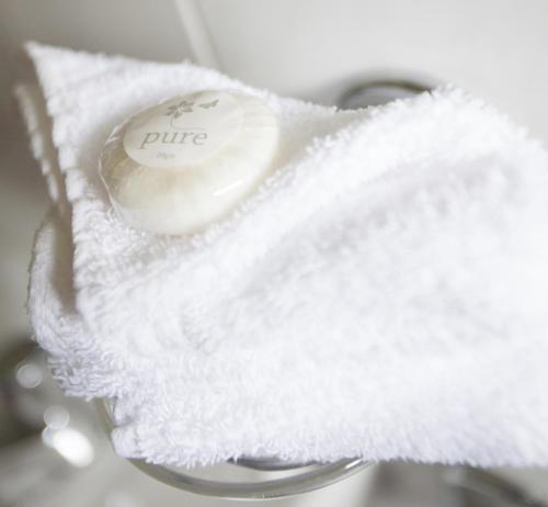 a roll of white towels sitting on top of a sink at Wicklow Way Lodge in Wicklow
