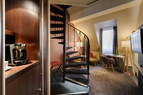 a spiral staircase in a hotel room at Mercure München City Center in Munich