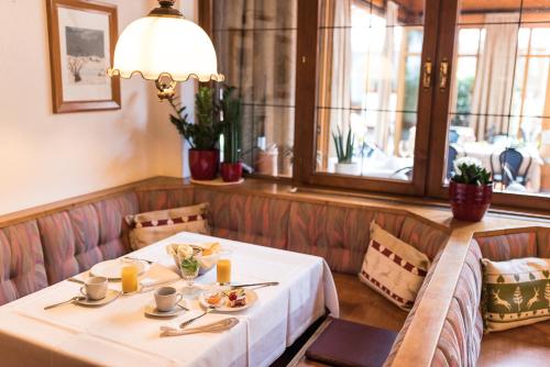 a table in a restaurant with a white table cloth at Gasthof zum Hirschen in Burgau