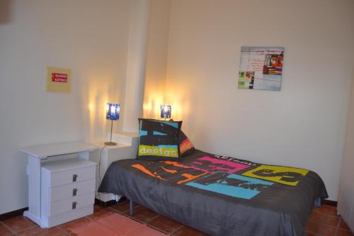 a bedroom with a bed and a nightstand and a bed sidx sidx sidx sidx at Ribeira Brava Studio Sea View in Ribeira Brava
