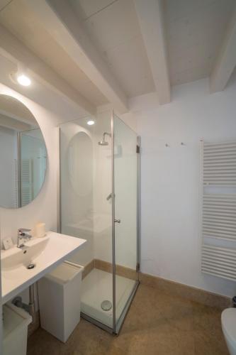 a bathroom with a shower and a sink at Academia Resort in Bergamo