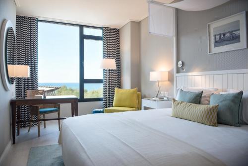 מיטה או מיטות בחדר ב- מלון מלודי - מלון בוטיק מרשת אטלס