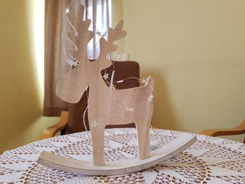 a wooden reindeer decoration on a table at Durda in Poronin