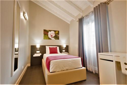 En eller flere senger på et rom på Quinta do Basalto
