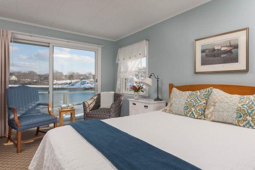 a bedroom with a bed and a view of the water at Dockside Guest Quarters in York