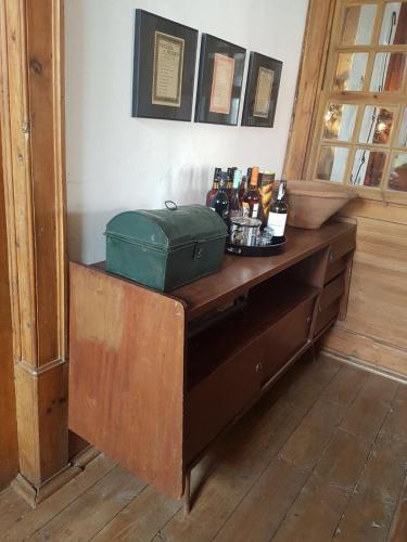 a table with a green suitcase on top of it at Casa da Vila in Penamacor