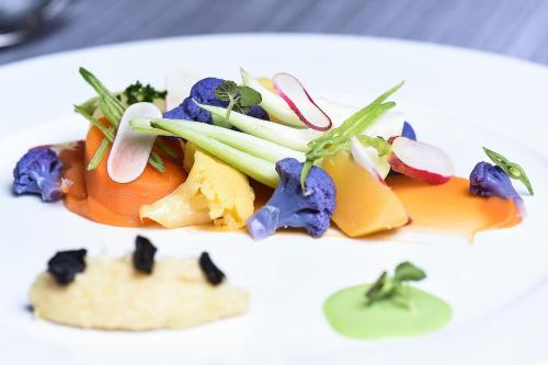 a plate of food on a white plate at Maison Philippe Le Bon Hôtel, Restaurant & Bar le 19 in Dijon