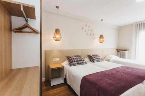 Ένα ή περισσότερα κρεβάτια σε δωμάτιο στο Hotel Catalunya Ribes de Freser