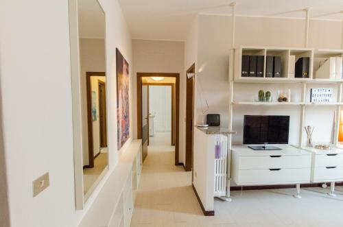 a hallway of a home with a white dresser at RotApartment - Monza in Monza