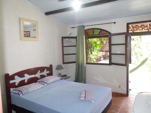 Ein Bett oder Betten in einem Zimmer der Unterkunft Suítes Brisa Mar