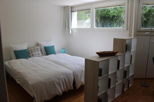 Postel nebo postele na pokoji v ubytování A Casa Fina- a modern room close to Basel