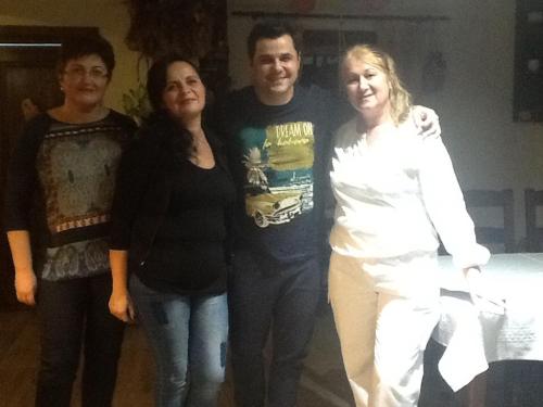 a group of people posing for a picture at Pensiunea Roua Muntelui in Brăzeşti