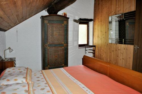 Llit o llits en una habitació de Rustico Gola di Lago