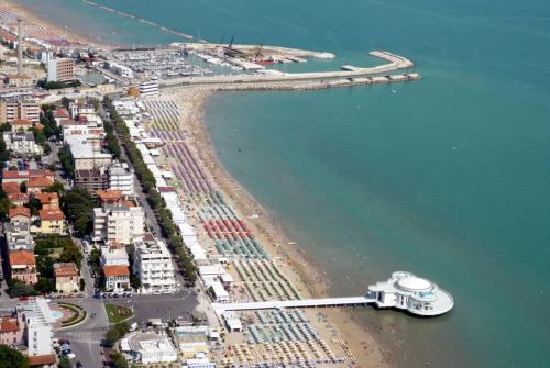 an aerial view of a beach with a cruise ship at Appartamento Via Rieti in Senigallia