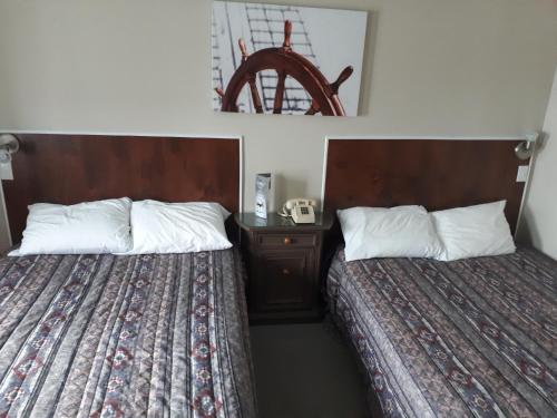 Postel nebo postele na pokoji v ubytování hotel au vieux bardeau