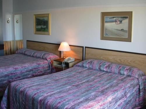 Postel nebo postele na pokoji v ubytování Auberge La Diligence