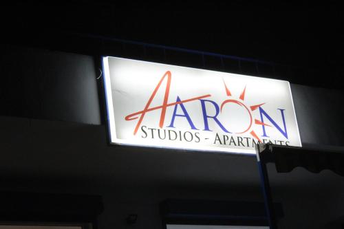a sign for a camera studioarmaarmaarmahibition on a building at Aaron Studios Apartments in Agia Fotia