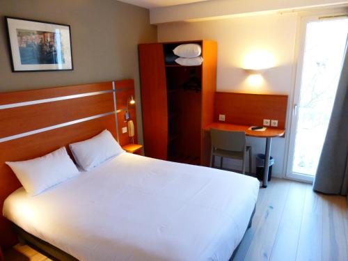 Katil atau katil-katil dalam bilik di Hotel & Restaurant Heliotel