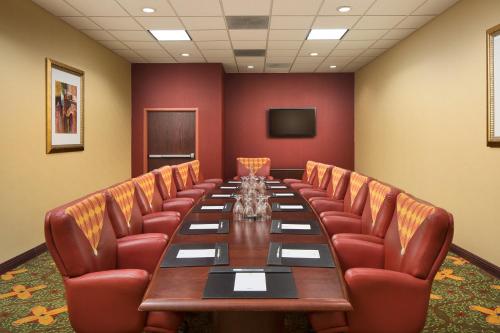 a conference room with a long table and leather chairs at University Plaza Hotel in Springfield