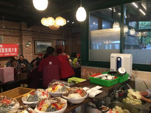 a table with bowls of food in a restaurant at Locasu in Datong