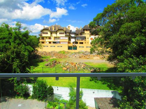 a view of a large house from a balcony at San Clemente Residence in Gramado