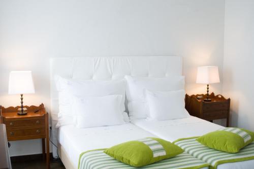 A bed or beds in a room at Casa do Comendador