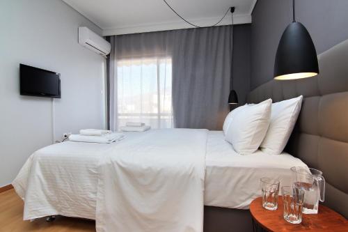 מיטה או מיטות בחדר ב-Central Apartment