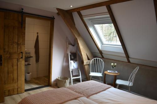 Кровать или кровати в номере Bed & Breakfast aan de Beek