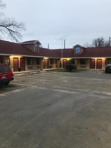 an empty parking lot in front of a motel at SouthTown S.A. Inn in San Antonio