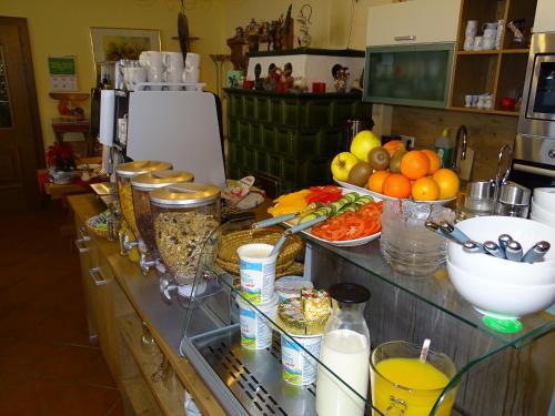 a kitchen counter with a bunch of food on it at Pension Bayrhammer in Faistenau