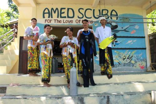 a group of people standing in front of a store at Pt putra momongan menyelam scuba in Amed