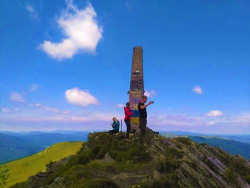 a group of people standing on top of a mountain at "LiAn" Family Hotel & Restaurant in Volosyanka