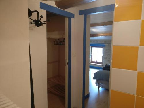 a room with a door leading to a bedroom at Des Km à La Ronde in La Ronde