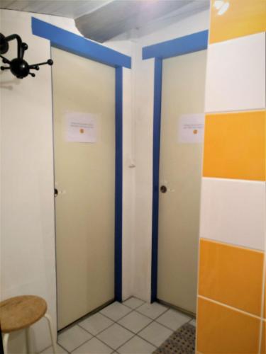 a room with two doors and a table at Des Km à La Ronde in La Ronde