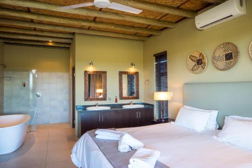 Ένα ή περισσότερα κρεβάτια σε δωμάτιο στο Mjejane Bush Camp by Dream Resorts
