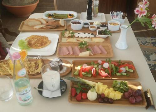 a table with many different types of food on it at Hotel Boutique Restaurant Gloria in Tirana