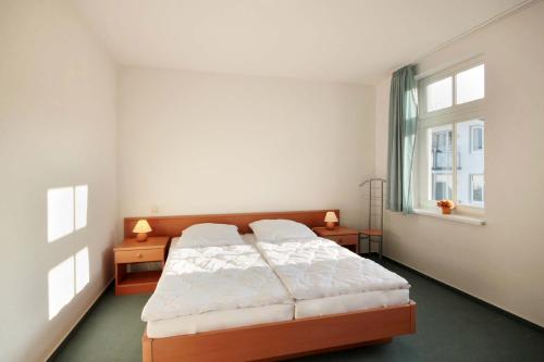 Postel nebo postele na pokoji v ubytování Villa Hans by Rujana