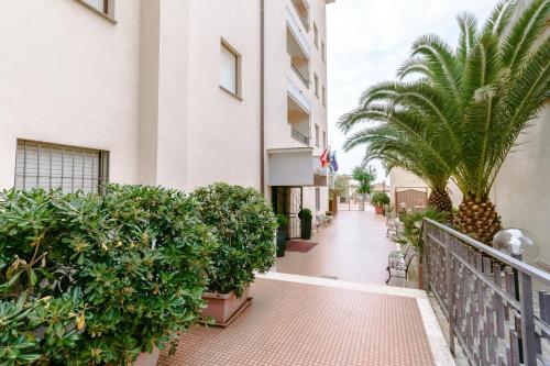 a balcony of a building with plants and trees at Le Terrazze in Follonica