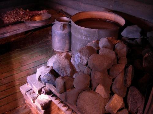 a pile of rocks sitting next to a pot at Albatross in Kaunata