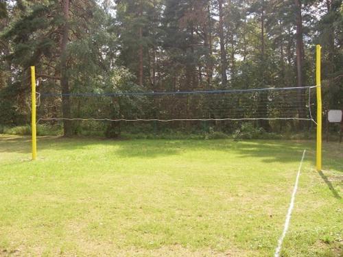 a net in the middle of a tennis court at Albatross in Kaunata