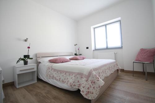 Ένα ή περισσότερα κρεβάτια σε δωμάτιο στο Casa ai Stabli 2