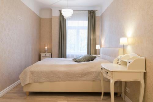 Postel nebo postele na pokoji v ubytování Allika Apartments