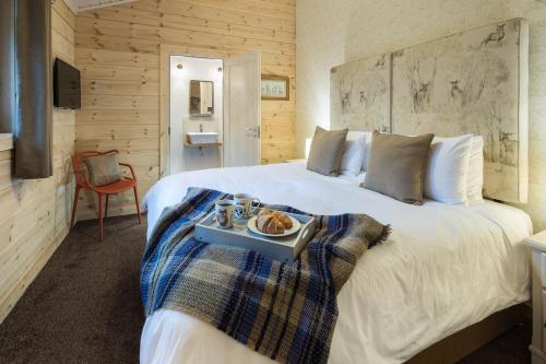 Ένα ή περισσότερα κρεβάτια σε δωμάτιο στο The Lodges at Artlegarth