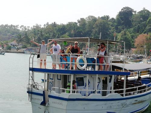 a group of people on a boat in the water at Mahi Villa in Bentota