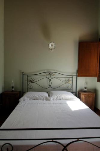 Postel nebo postele na pokoji v ubytování Corte Stellata Holiday Apartments