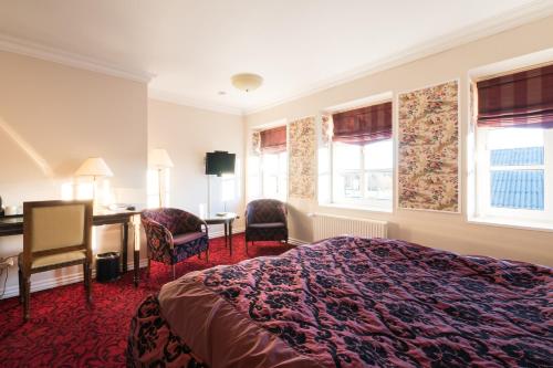 Postel nebo postele na pokoji v ubytování Den Gamle Grænsekro Inn