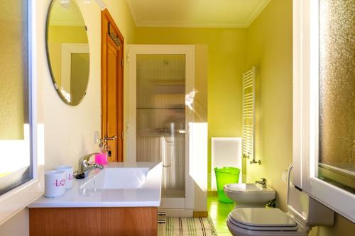 a bathroom with a sink and a toilet at Casa da Oliveira in Mondim de Basto