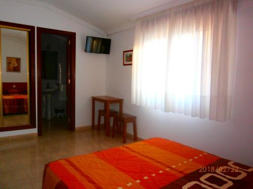 Katil atau katil-katil dalam bilik di Pension As Termas
