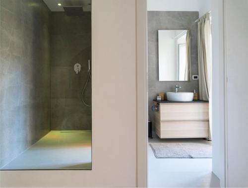 a bathroom with a sink and a mirror at Suite Dreams in Agrigento